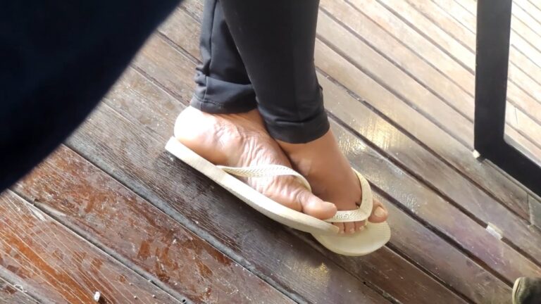 candid feet in white flipflops