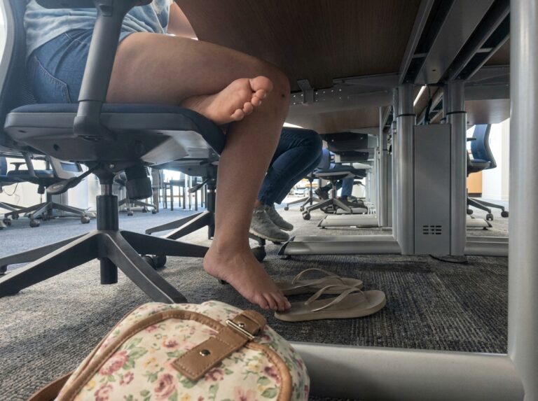 candid feet under the table