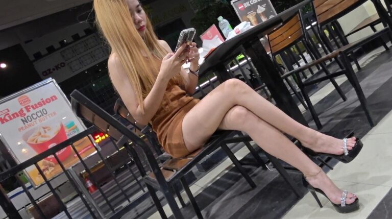 Asian candid shoeplay in high heels dangling
